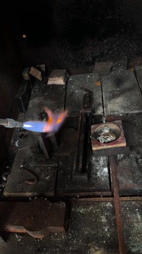 Metalworking with torch observed in Cordoba workspace