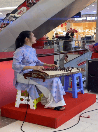 Traditional music performances and shopping activities in Nha Trang mall