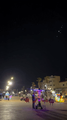 Evening promenade activity with children's rides in Safi, Morocco