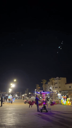 Evening promenade activity with children's rides in Safi, Morocco