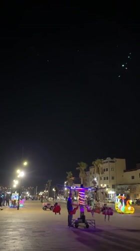 Evening promenade activity with children's rides in Safi, Morocco