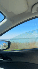 Driver captures scenic lakeside views during morning drive near Burgas