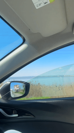 Driver captures scenic lakeside views during morning drive near Burgas