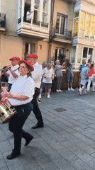 Giant folk figures parade through Vitoria-Gasteiz streets at dusk