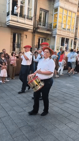 Giant folk figures parade through Vitoria-Gasteiz streets at dusk