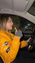 Woman drives through Naberezhnye Chelny singing to music at night