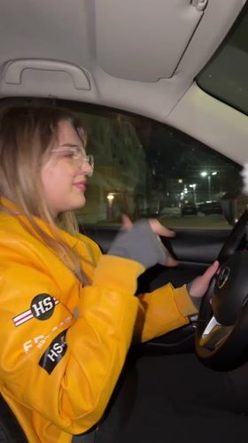 Woman drives through Naberezhnye Chelny singing to music at night