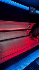 Woman takes selfie in Moscow tanning booth