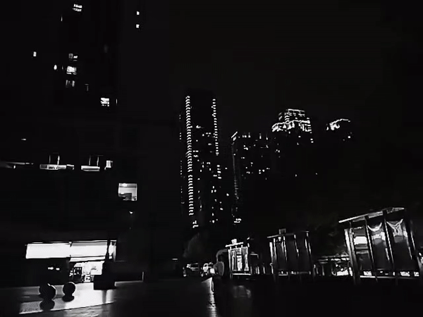 Nighttime urban scene documented in Yuzhong District public space