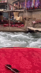 Riverside dining and cherry vendors active in Asgaour, Morocco