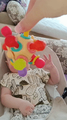 Baby playtime with colorful toys documented in Tobolsk, Russia