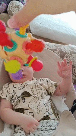 Baby playtime with colorful toys documented in Tobolsk, Russia