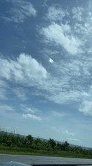 Rainbow streak spotted in clouds over Russian highway