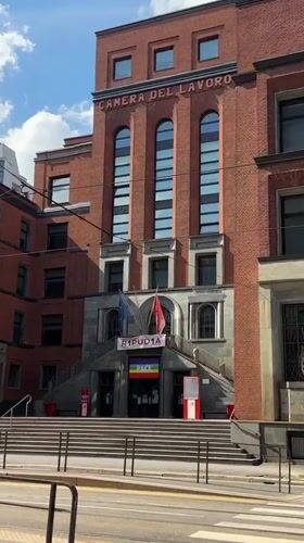 Milan afternoon walk captures labor building, historic pastry shop, dog