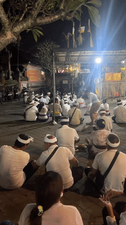 Traditional nighttime temple ceremony draws white-clad worshippers in Sukawati