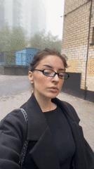 Woman photographed on foggy Moscow street during spring morning