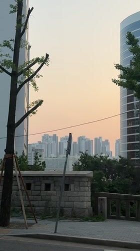 Seoul restaurant worker prepares temaki sushi under orange skies