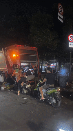 Garbage truck-motorcycle accident aftermath documented in North Jakarta