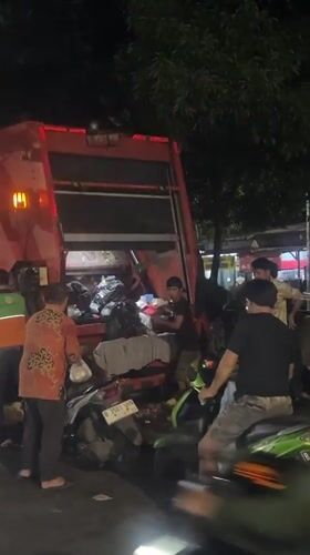 Garbage truck-motorcycle accident aftermath documented in North Jakarta