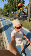 Woman walks blue pedestrian path in Fethiye, Turkey