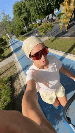 Woman walks blue pedestrian path in Fethiye, Turkey