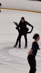 Figure skaters in motion on a Vidnoye ice rink