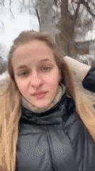 Woman takes winter selfies in snowy Ukrainian town