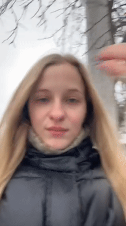Woman takes winter selfies in snowy Ukrainian town