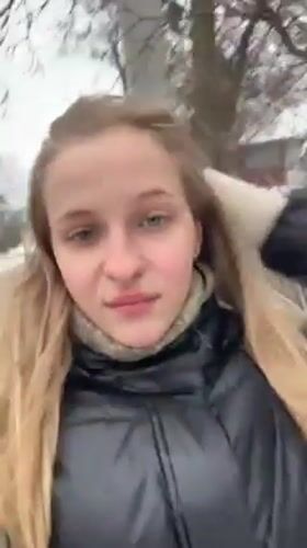 Woman takes winter selfies in snowy Ukrainian town