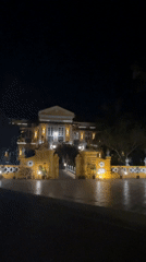 Illuminated grand mansion documented at night in Marna, India