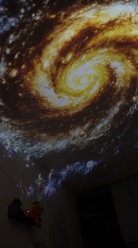Art installation with galaxy projections documented in Kiryat Bialik