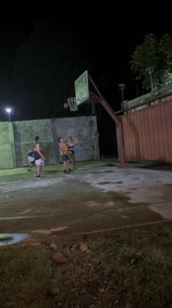 Nighttime basketball game and gathering in Tagum City