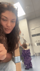 Woman films selfie with baby in mirror