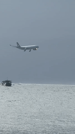 Morning beach scenes and low aircraft captured in Kuta
