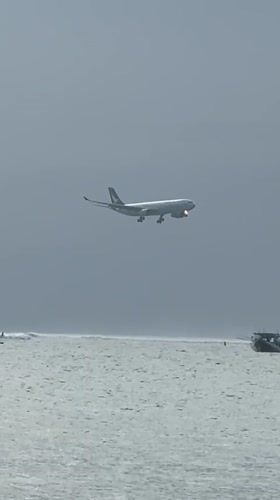 Morning beach scenes and low aircraft captured in Kuta