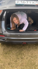 Young person speaks from SUV trunk in Chaikovsky, Russia