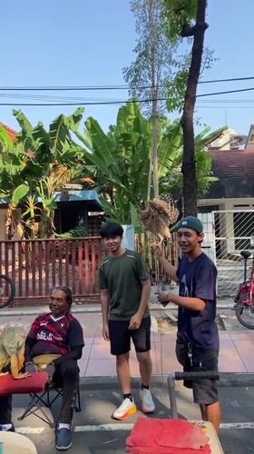 Community street fair with face painting, food vendors in Surabaya