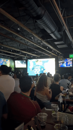 Soccer watch party at an LA bar, streets busy outside