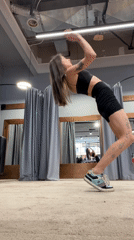 Woman practices yoga, acrobatics at Krasnoyarsk fitness studio