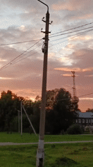 Sunset hour around a cell tower in Vereya, Russia