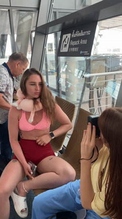 Woman photographed at Mai Khao transport hub wearing summer attire