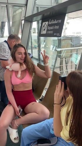 Woman photographed at Mai Khao transport hub wearing summer attire