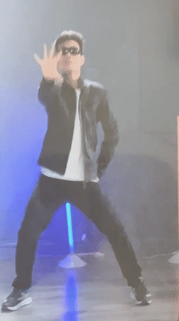 Man performs dance routine in blue-lit Gatineau studio