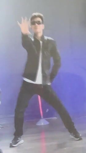 Man performs dance routine in blue-lit Gatineau studio