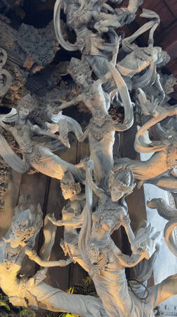 Traditional Balinese carvings and cats observed in Ubud