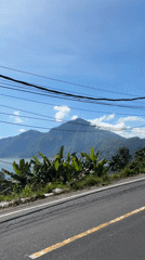 Tourist captures Mount Batur lakeside views in Kintamani, Indonesia