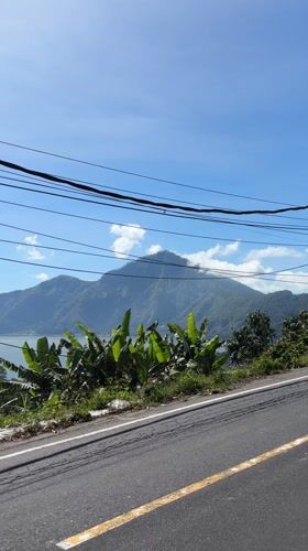 Tourist captures Mount Batur lakeside views in Kintamani, Indonesia
