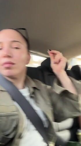 Women film selfie video during car ride in Giza