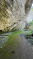 Tourists explore Bulgarian cave system and river during spring outing