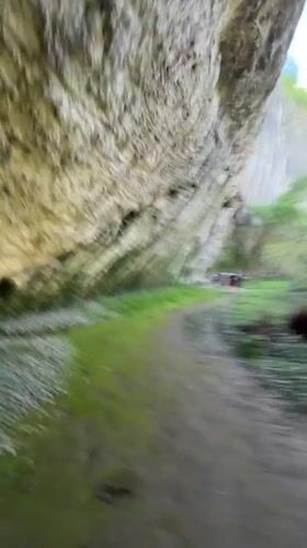 Tourists explore Bulgarian cave system and river during spring outing